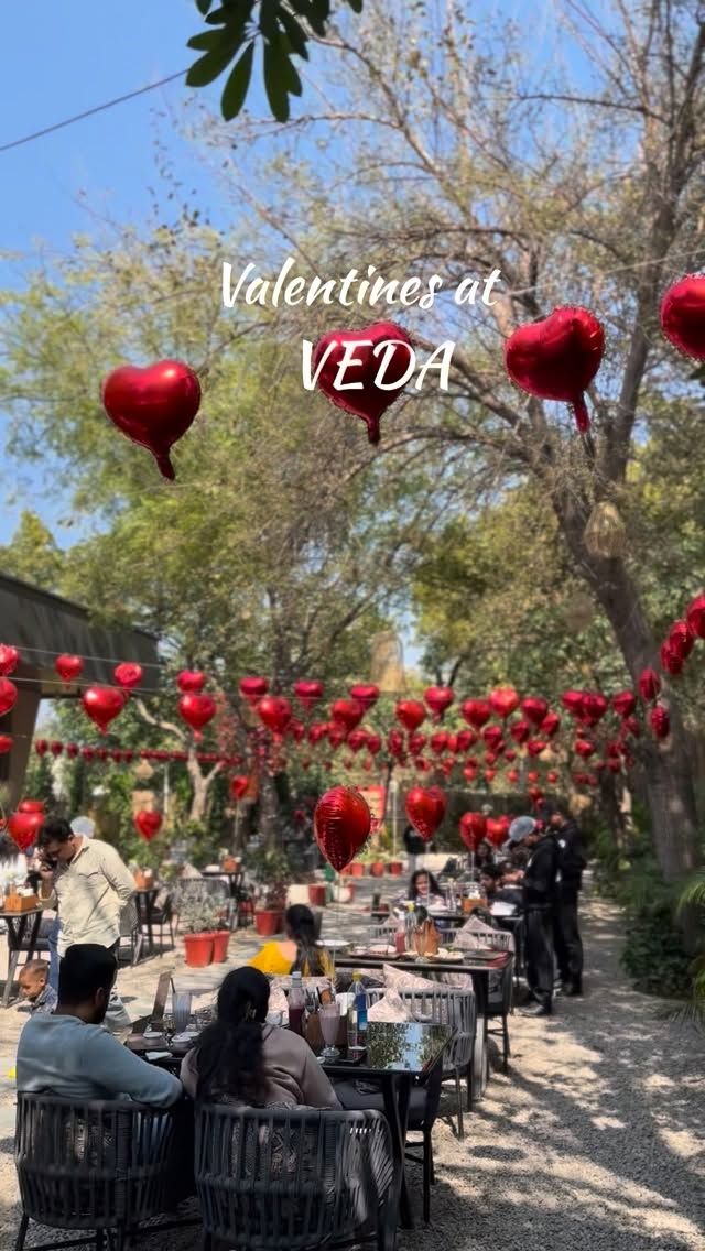 The garden decorated with red heart balloons for Valentine’s Day